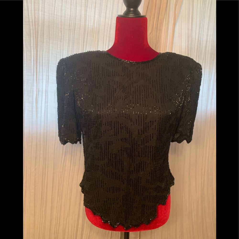 Vintage sequenced top.